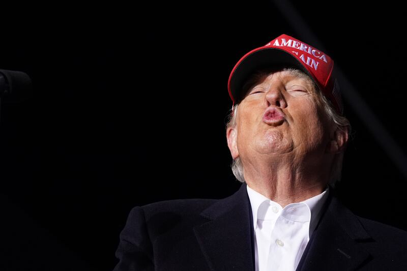 Donald Trump blows a kiss to the crowd during a rally at the Florence Regional Airport on March 12, 2022 in Florence, South Carolina.