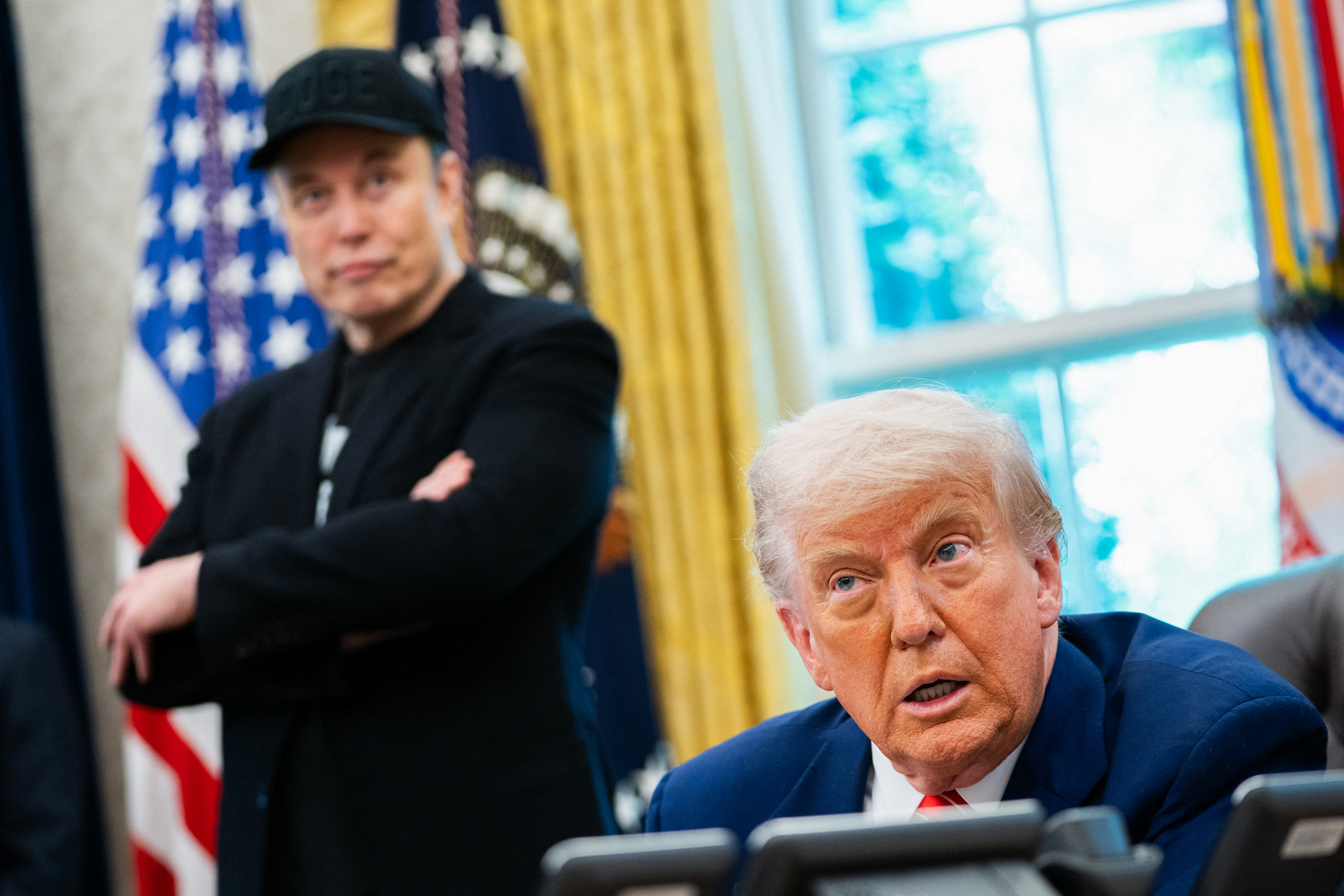 US President Donald Trump speaks during a news conference with Elon Musk.