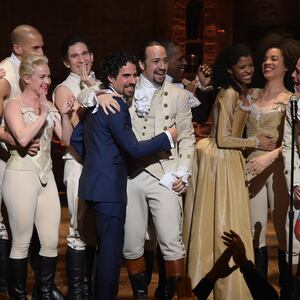 Music director Alex Lacamoire and actor, composer Lin-Manuel Miranda and cast of "Hamilton" celebrate on stage the receiving of GRAMMY award after "Hamilton" GRAMMY performance for The 58th GRAMMY Awards at Richard Rodgers Theater on February 15, 2016 in New York City.