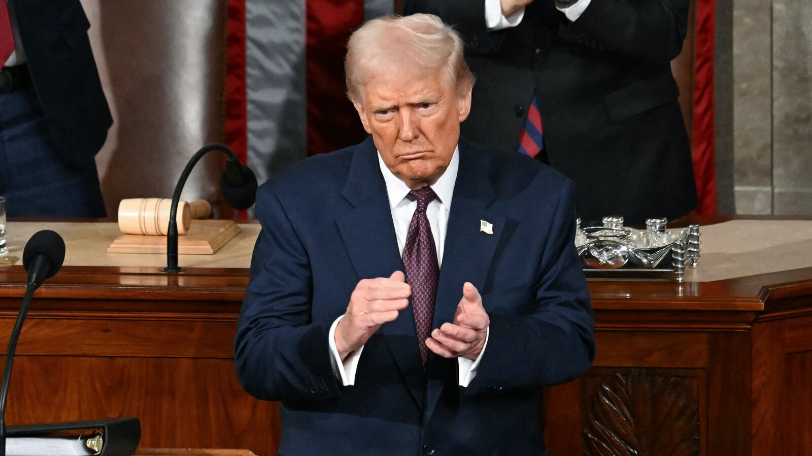 US President Donald Trump stands and applauds as he concludes his address to a joint session of Congress in the House Chamber of the US Capitol in Washington, DC, on March 4, 2025. (Photo by Jim WATSON / AFP) (Photo by JIM WATSON/AFP via Getty Images)