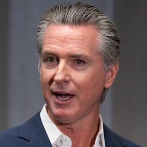 Governor Gavin Newsom speaks to the media during a signing of Bill AB1454