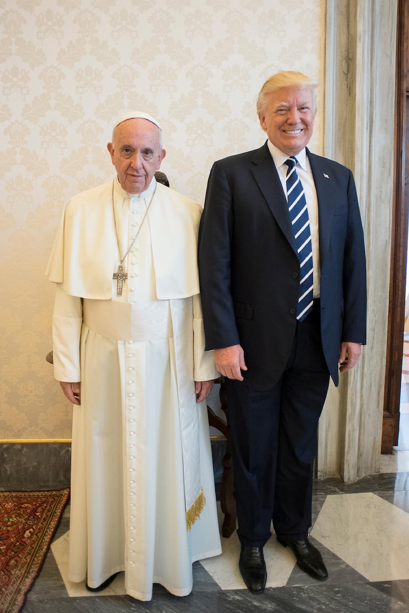 Pope Francis poses with President Donald Trump during a private audience at the Vatican, May 24, 2017.