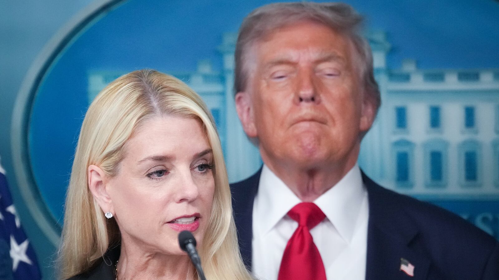 WASHINGTON, DC - AUGUST 11: Attorney General Pam Bondi delivers remarks as U.S. President Donald Trump looks on during a press conference in the James S. Brady Press Briefing Room of the White House August 11, 2025 in Washington, DC. Trump announced he will use his authority to place the DC Metropolitan Police Department under federal control to assist in crime prevention in the nation’s capital, and that the National Guard will be deployed to DC. (Photo by Andrew Harnik/Getty Images)
