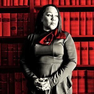 A photo illustration of Fani Willis where she is standing in front of a book case
