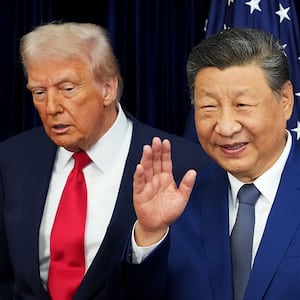 U.S. President Donald Trump and Chinese President Xi Jinping react after posing for photos ahead of a bilateral meeting at Gimhae Air Base on October 30, 2025 in Busan, South Korea.