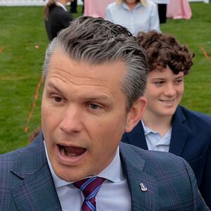 Pete Hegseth speaks to the press in front of his children.