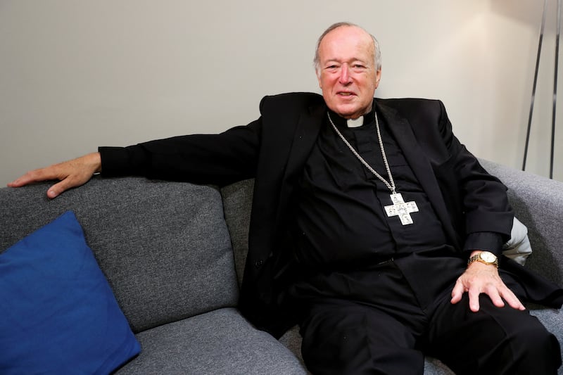 Robert McElroy poses for photographers in 2022.