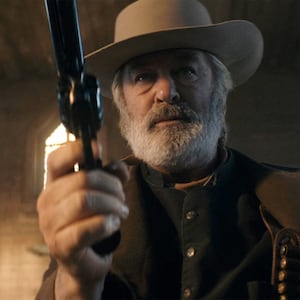 Alec Baldwin practicing a scene with a revolver on the set of Rust.