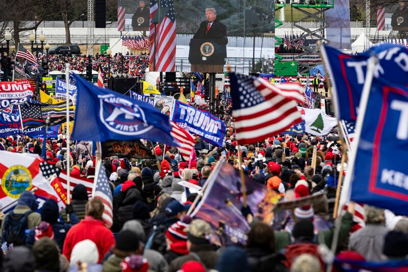 President Donald Trump is seen on a screen as his supporters cheer during a rally on the National Mall on January 6, 2021 in Washington, DC.
