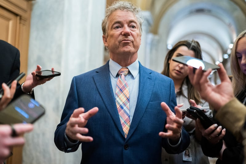 Senator Rand Paul (R-KY) surrounded by members of the media ahead of a Senate vote.