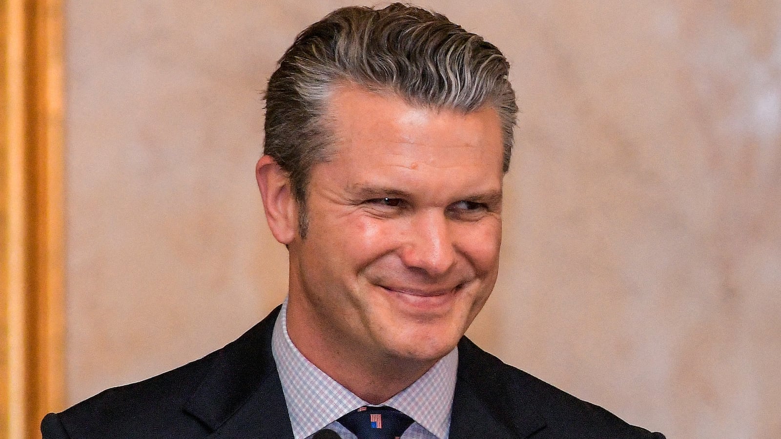 US Secretary of Defense Pete Hegseth smiles during a press conference at the Dominican National Palace in Santo Domingo on November 26, 2025.