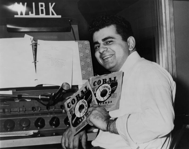 Disc jockey, TV personality and actor Casey Kasem in the DJ booth at WJBK radio station in 1957 in Detroit, Michigan.
