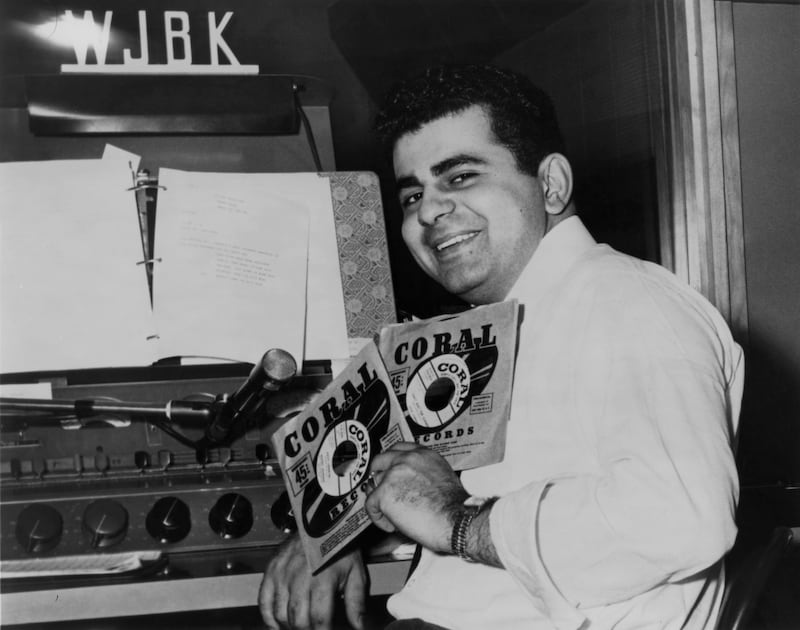 Disc jockey, TV personality and actor Casey Kasem in the DJ booth at WJBK radio station in 1957 in Detroit, Michigan.