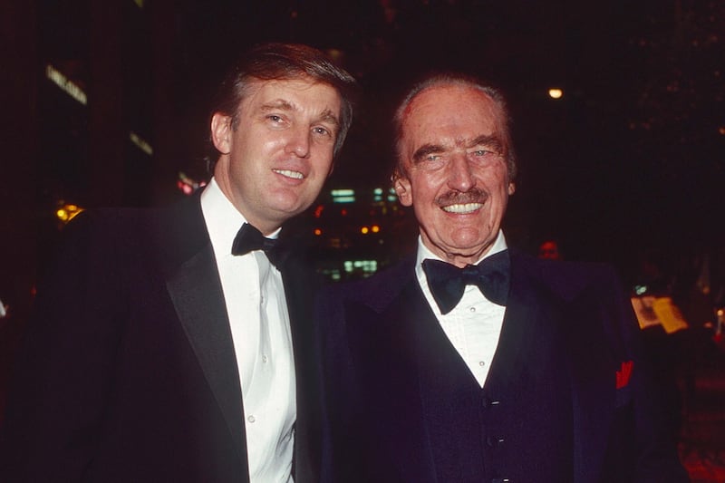Portrait of American son and father real estate developers Donald Trump and Fred Trump (1905 - 1999) as they attend a book release party to celebrate 'Trump: The Art of the Deal' in the Trump Tower Atrium, New York, New York, December 12, 1987. (Photo by Sonia Moskowitz/Getty Images)