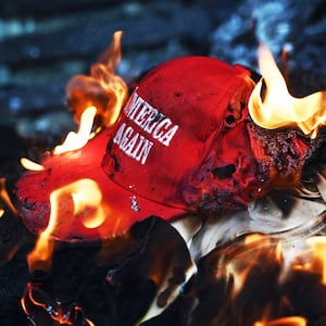 A "Make America Great Again" hat on fire.