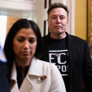 UNITED STATES - MARCH 5: Elon Musk, of the Department of Government Efficiency, leaves a lunch with senate Republicans in the U.S. Capitol on Wednesday, March 5, 2025. DOGE aide Katie Miller appears at left. (Tom Williams/CQ-Roll Call, Inc via Getty Images)