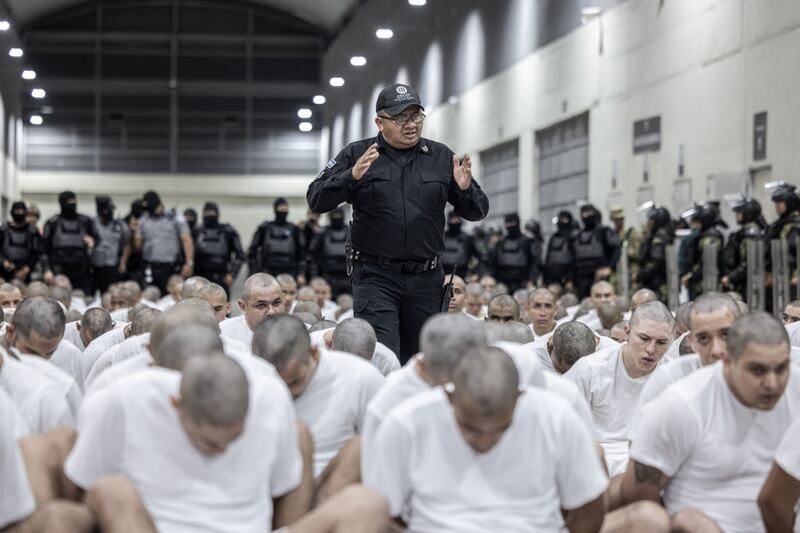 The 250 men deported by the Trump administration for their alleged gang ties arrive in El Salvador.