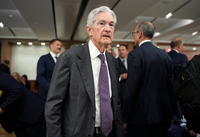 Federal Reserve Chairman Jerome Powell arrives for a conference at the Federal Reserve on July 22 as President Trump continues to attack him over interest rates.