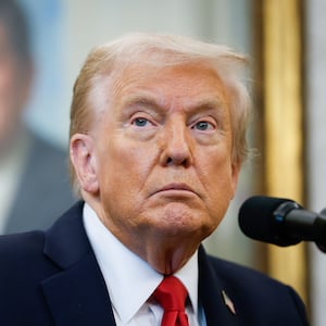 President Donald Trump answers questions from reporters during an event in the Oval Office of the White House on October 16, 2025 in Washington, DC.