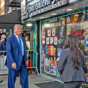 A photo of Donald Trump smiling as he walks into a bodega in Manhattan. 