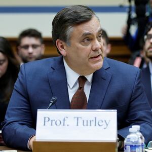 Jonathan Turley looks to the left while speaking during a House committee meeting.