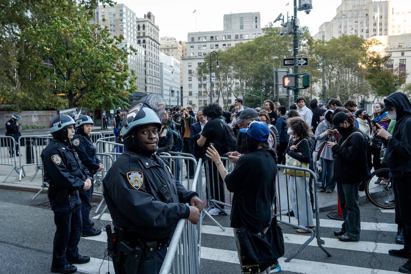 Crowds gathered as agents tried to detain individuals, and at least one person was arrested, according to DHS.