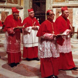 The procession of the Sacred College of Cardinals file into the Sistine Chapel