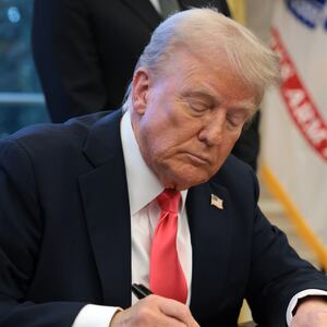 WASHINGTON, DC - FEBRUARY 25: U.S. President Donald Trump signs an executive order in the Oval Office at the White House on February 25, 2025 in Washington, DC. Trump signed an executive order on suspending security clearances held by Peter Koski and members, partners, and employees of Covington & Burling LLP who assisted former Special Counsel Jack Smith during his time as Special Counsel.  (Photo by Alex Wong/Getty Images)