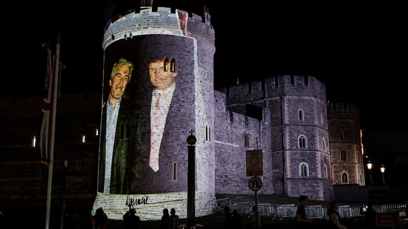 An image of U.S. President Donald Trump alongside disgraced financier Jeffrey Epstein is projected on Windsor castle, after U.S. President Donald Trump and first lady Melania Trump arrival for a state visit to the country, in Windsor, Berkshire, Britain September 16, 2025. REUTERS/Phil Noble     TPX IMAGES OF THE DAY