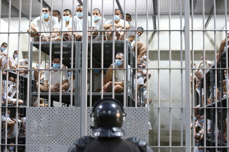 Inmates are pictured in a jail cell during a media tour at the Terrorism Confinement Center (CECOT) prison in Tecoluca, El Salvador on April 4, 2025.