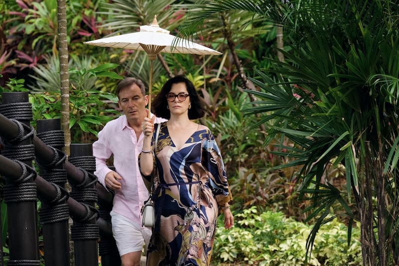 Jason Isaacs and Parker Posey