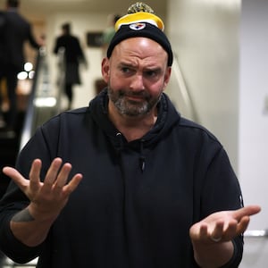 John Fetterman speaks with reporters at the US Capitol.