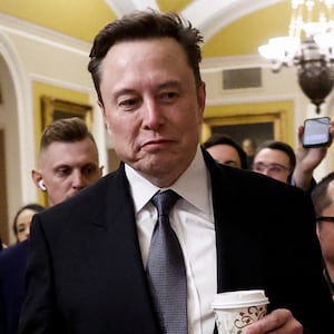 Elon Musk walks on Capitol Hill on the day of a meeting with Senate Republican Leader-elect John Thune (R-SD), in Washington, U.S. December 5, 2024.