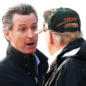 Donald Trump speaks with Gavin Newsom at Beale Air Force Base, California, U.S., November 17, 2018.