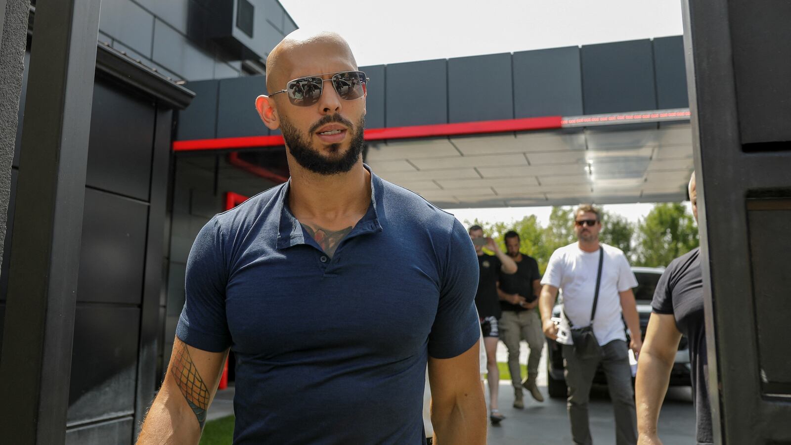 Andrew Tate delivers a press statement outside his house in Romania.