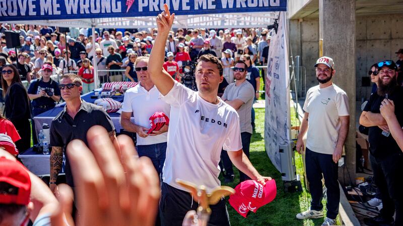 Right-wing activist and commentator Charlie Kirk throws hats to the crowd shortly before he was shot at a Utah Valley University speaking event in Orem, Utah, Sept. 10, 2025.