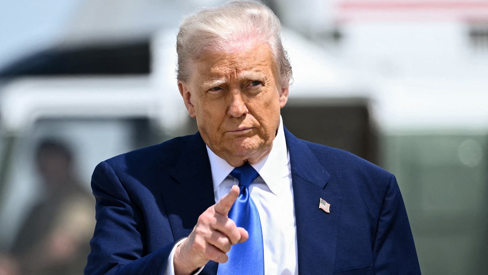 US President Donald Trump gestures as he walks to board Air Force One at Joint Base Andrews in Maryland on May 12, 2025. President Trump is travelling to the Middle East, where Saudi Arabia will be the first stop on a four-day trip. (Photo by Brendan SMIALOWSKI / AFP) (Photo by BRENDAN SMIALOWSKI/AFP via Getty Images)