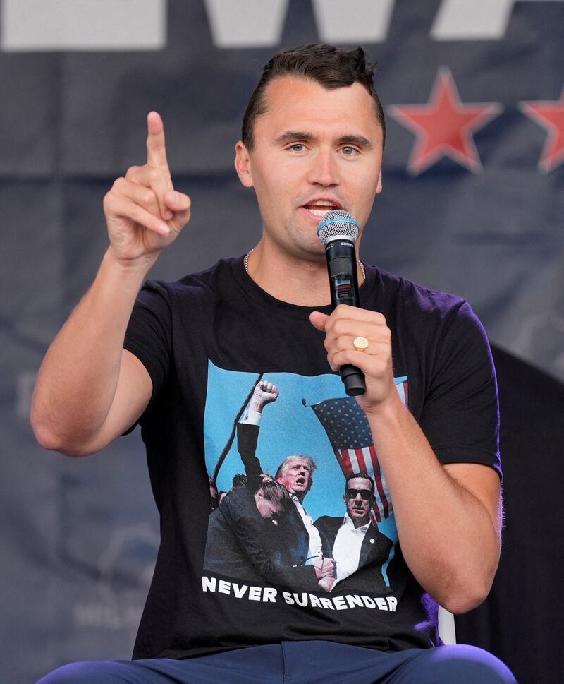 Charlie Kirk speaks while wearing a shirt with a picture taken during Republican then-presidential nominee Donald Trump's attempted assassination on Day 3 of the Republican National Convention (RNC), at the Fiserv Forum in Milwaukee, WI on July 17, 2024.