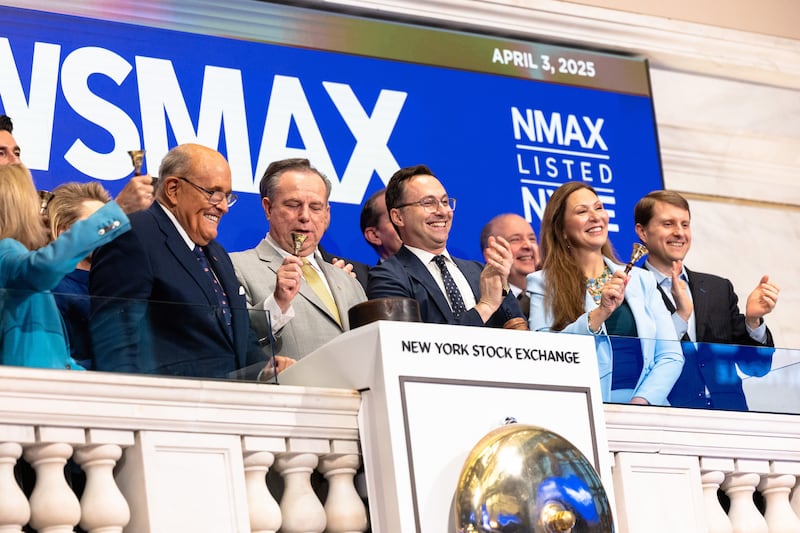 Former New York City Mayor Rudy Giuliani and Chris Ruddy, CEO of Newsmax, celebratethe ringing the opening bell at the New York Stock Exchange