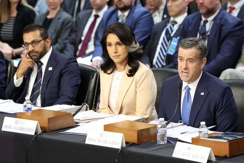 McCarthy wondered if Gabbard reads reports generated by the CIA under John Radcliffe (right).