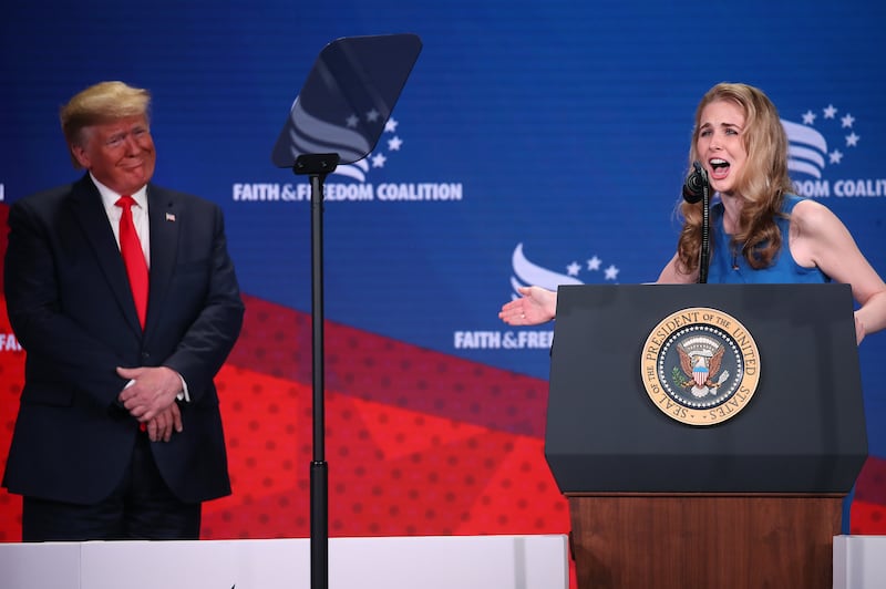 Natalie Harp speaking on stage alongside Donald Trump in 2019.