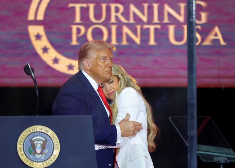 President Donald Trump embraces Erika Kirk.