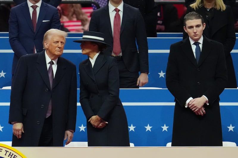 WASHINGTON, DC - JANUARY 20: U.S. President Donald Trump, first lady Melania Trump, and Barron Trump watch during an indoor inauguration parade at Capital One Arena on January 20, 2025 in Washington, DC. Donald Trump takes office for his second term as the 47th president of the United States. (Photo by Christopher Furlong/Getty Images)