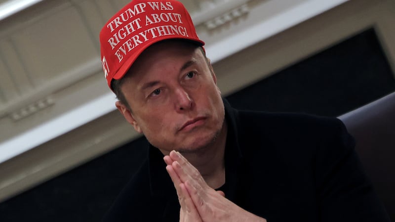 Tesla CEO Elon Musk wears a 'Trump Was Right About Everything!' hat while attending a cabinet meeting at the White House in Washington, D.C., on March 24, 2025.