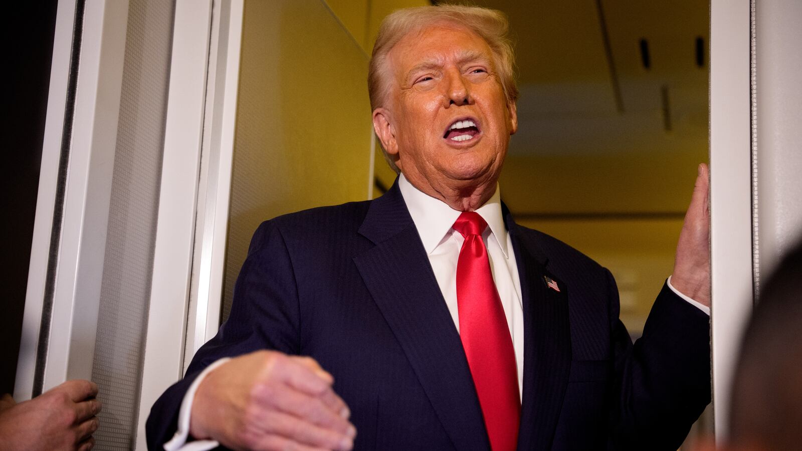 President Donald Trump speaks to members of the media aboard Air Force One on October 30, 2025 in flight.