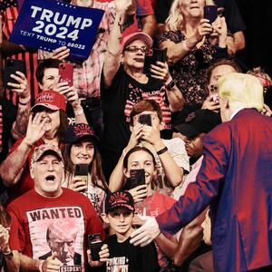 A photo illustration showing a crowd of screaming for Donald Trump during the South Dakota Republican Party's Monumental Leaders rally at the Ice Arena at the Monument in Rapid City, South Dakota, September 8, 2023