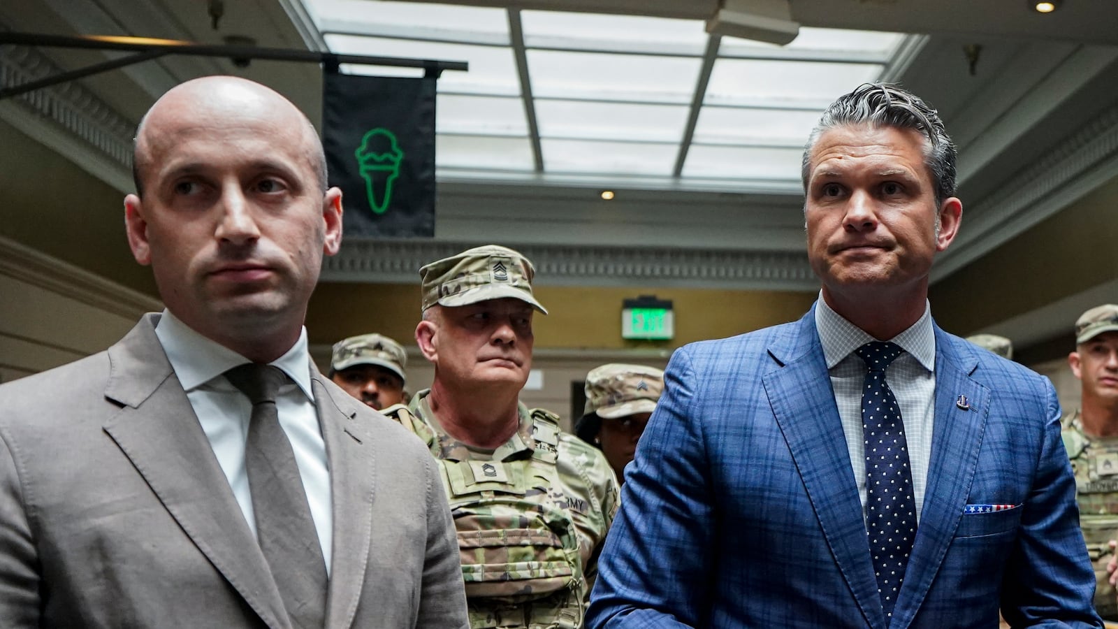 WASHINGTON, DC - AUGUST 20: (L-R) White House Deputy Chief of Staff Stephen Miller and Defense Secretary Pete Hegseth speak with members of the National Guard during a visit to Union Station on August 20, 2025 in Washington, D.C. The Trump administration has deployed federal officers and the National Guard to the District in order to place the DC Metropolitan Police Department under federal control and assist in crime prevention in the nation's capital.