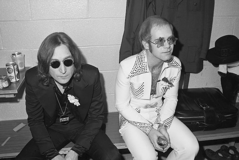 Elton and John Lennon anxiously wait backstage before performing together at Madison Square Garden in front of a sold out crowd in 1974.
