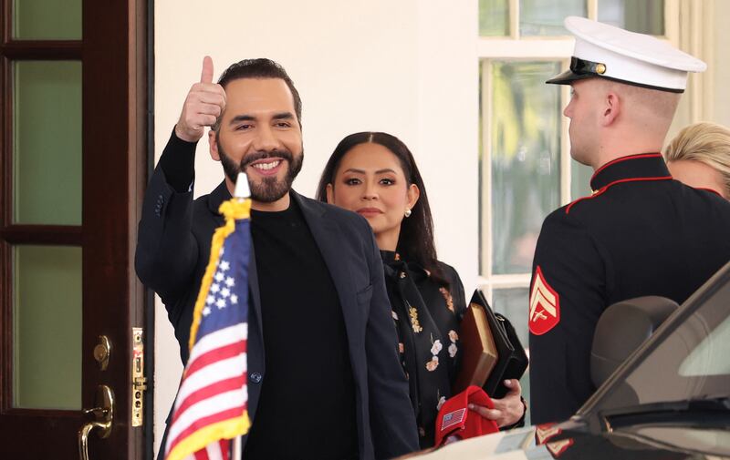 El Salvador President Bukele gives a thumbs up as he departs the White House.