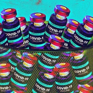 Covid vaccine vials in a garbage can photo illustration